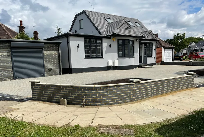 Completed four-bedroom bungalow in Harrow with a new frontage, low brick wall and paved driveway