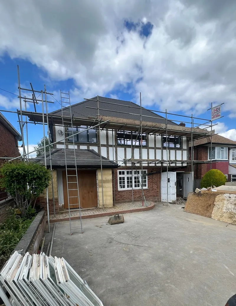 Detached house in Ickenham with scaffolding up and building materials delivered to the driveway